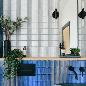 Modern terrazzo tiled bathroom with black hardware