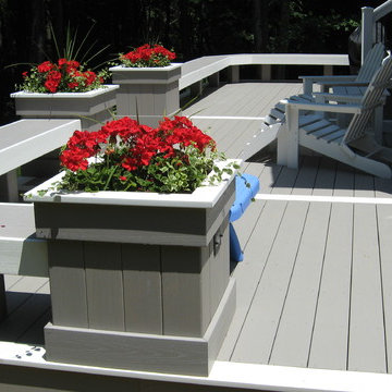 Screened in sunroom with two tier wrap around AZEK deck