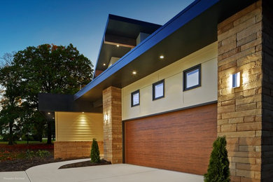 This is an example of a large contemporary attached two-car carport in Chicago.