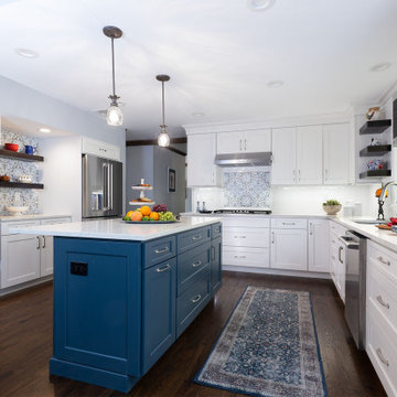 White kitchen with blue island in Long Valley