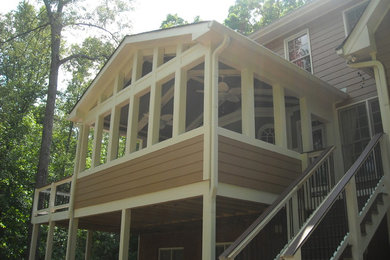 Mid-sized classic back porch idea in Atlanta with decking and a roof extension