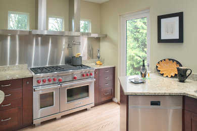 Trendy kitchen photo in Vancouver with granite countertops and stainless steel appliances