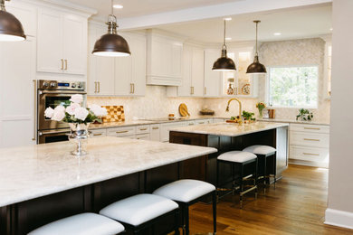 Open concept kitchen - large transitional l-shaped dark wood floor open concept kitchen idea in DC Metro with recessed-panel cabinets, dark wood cabinets, quartz countertops, beige backsplash, mosaic tile backsplash, two islands and beige countertops