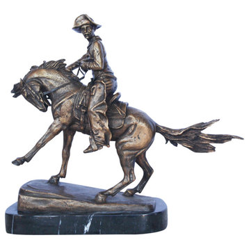 Remington replica Cowboy bronze statue -  Size: 5"L x 15"W x 13"H.