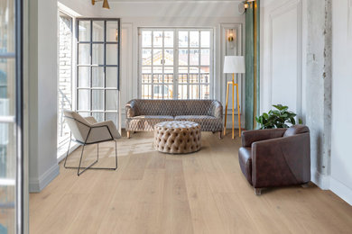Living room - brown floor and light wood floor living room idea in Other