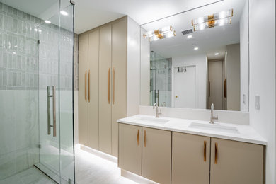Inspiration for a large modern master double-sink toilet room remodel in Vancouver with a bidet, an undermount sink, quartzite countertops and white countertops