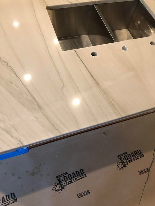 What should I do about tape stain on quartzite