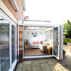 White Conservatory with PVCu Bi-Fold Doors - Products