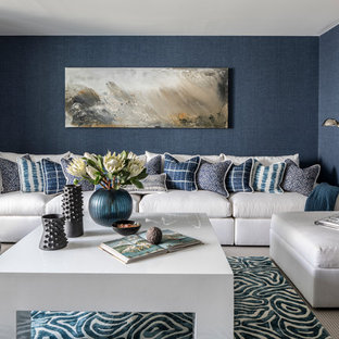 Large classic walk-out basement in New York with blue walls, limestone flooring and grey floors.