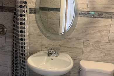 Inspiration for a small transitional gray tile and ceramic tile ceramic tile, gray floor and single-sink doorless shower remodel in Chicago with a pedestal sink