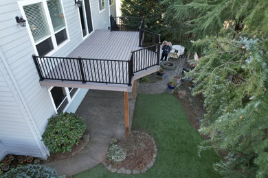 Inspiration for a mid-sized contemporary backyard second story metal railing deck remodel in Portland with no cover