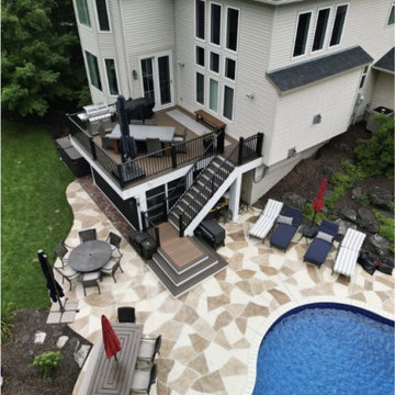 Multi-Level Composite Deck with Curved Stairs to Pool Patio