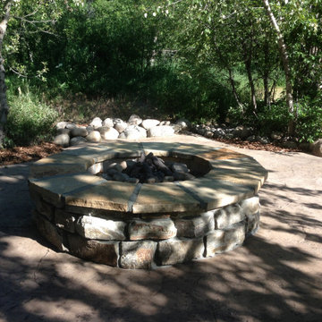 Fire Pit Area with silt sandstone block rock and stamped concrete