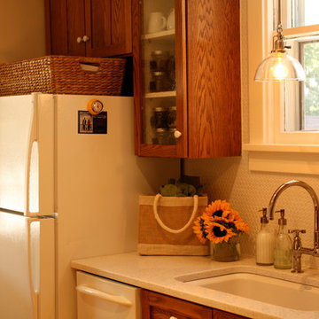 Glass-front cabinets show off a tea collection and accoutrement.