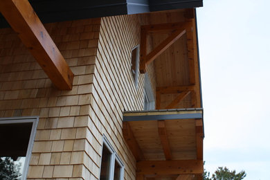 Example of a country exterior home design in Other