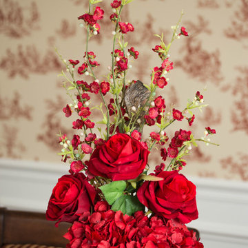 DIning Room with Red Victorian Wallpaper and Red Faux Floral Centerpiece