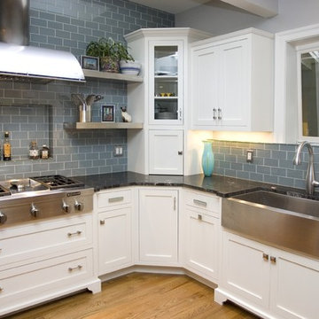 Custom shelving and under cabinet lighting, deep stainless steel sink