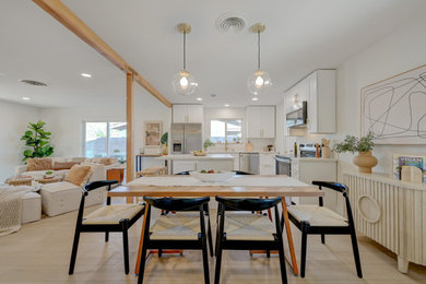 Inspiration for a mid-sized contemporary laminate floor and beige floor dining room remodel in Las Vegas with white walls