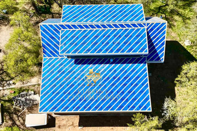 Inspiration for a modern exterior home remodel in Austin with a metal roof and a black roof