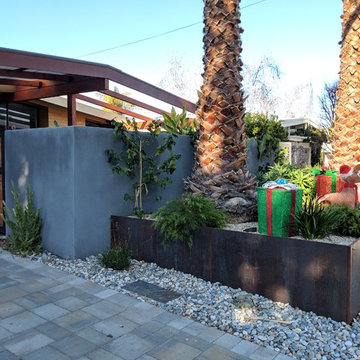 Secured Custom Steel Framed Gates with Slab Accent Garden Wall
