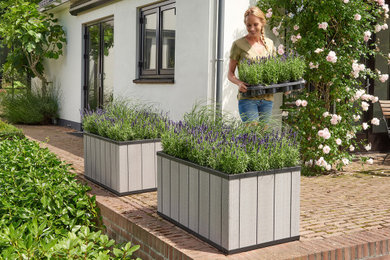Patio container garden - large modern backyard patio container garden idea in Indianapolis