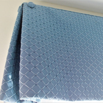 Box pleat valances enhanced with covered buttons in a quiet study