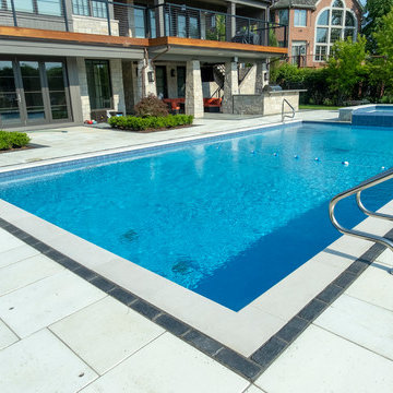 Burr Ridge Lap Pool with Raised Hot Tub and Waterfall
