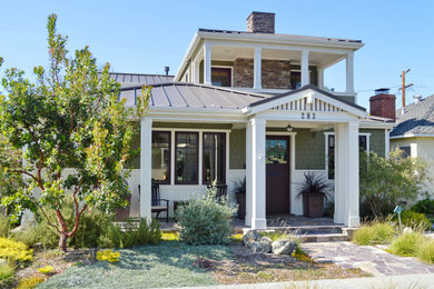 Inspiration for a country two-story concrete fiberboard and shingle exterior home remodel in Los Angeles