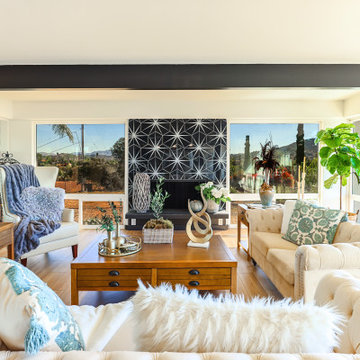 Stylish Living Room with Bold Fireplace Accent Wall and Panoramic Views