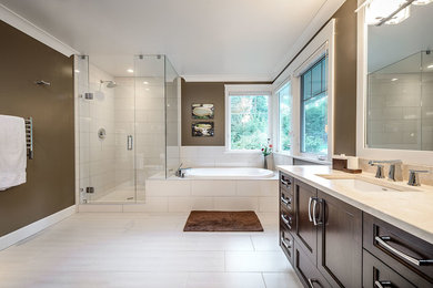 Contemporary master bathroom in Vancouver with recessed-panel cabinets, brown cabinets, a drop-in tub, a corner shower, brown walls, ceramic floors, a drop-in sink and engineered quartz benchtops.