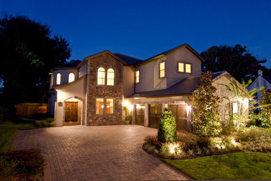 Large elegant beige two-story mixed siding gable roof photo in Orlando