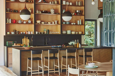 Example of an island style kitchen design in Milwaukee