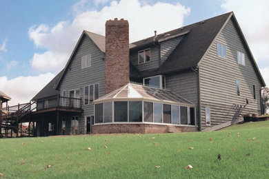 Inspiration for a large timeless sunroom remodel in Other with a skylight