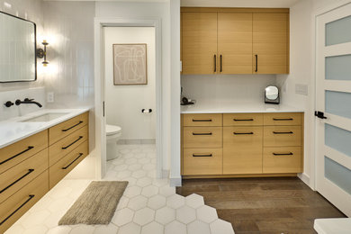 Bathroom - mid-sized modern master white tile cement tile floor, white floor and double-sink bathroom idea in Other with flat-panel cabinets, medium tone wood cabinets, a one-piece toilet, white walls, an undermount sink, quartzite countertops, a hinged shower door, white countertops and a floating vanity