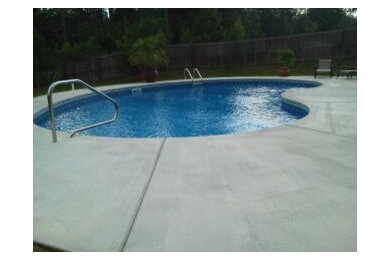 Inspiration for a mid-sized backyard kidney-shaped pool remodel in Other