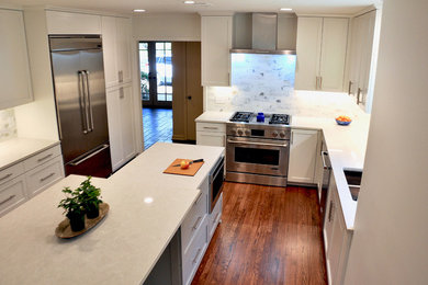 Eat-in kitchen - contemporary eat-in kitchen idea in Jackson with shaker cabinets, white cabinets, quartz countertops, white backsplash, an island and white countertops