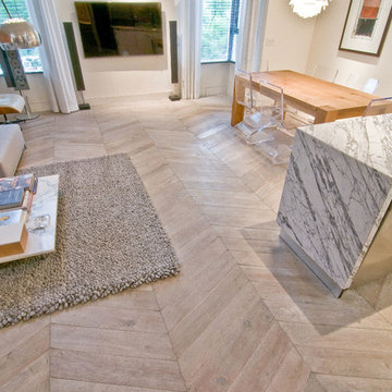 Living + Dining Area Features Chevron Hardwood Flooring