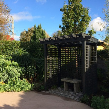 Garden pergola within lush planting