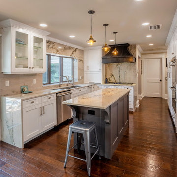 U-Shaped Kitchen Layout With Mixed-Finish Cabinetry and Natural Stone Accents