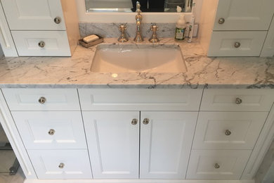 Elegant 3/4 bathroom photo in Chicago with marble countertops