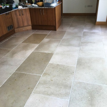 White Tumbled Marble Tiled Floor Refreshed in a Hampton Kitchen