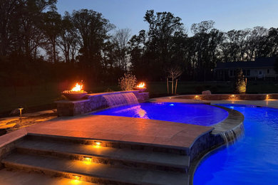 Huge arts and crafts backyard custom-shaped natural pool photo in DC Metro