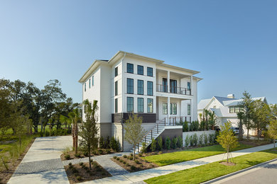 Inspiration for a huge modern white three-story mixed siding exterior home remodel in Charleston with a hip roof