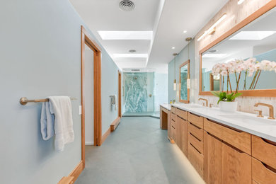 1960s master white tile and marble tile slate floor, green floor and double-sink bathroom photo in Denver with furniture-like cabinets, medium tone wood cabinets, a one-piece toilet, green walls, an undermount sink, quartz countertops, white countertops and a floating vanity