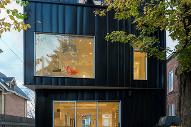 Inspiration for a mid-sized contemporary black three-story metal exterior home remodel in Toronto