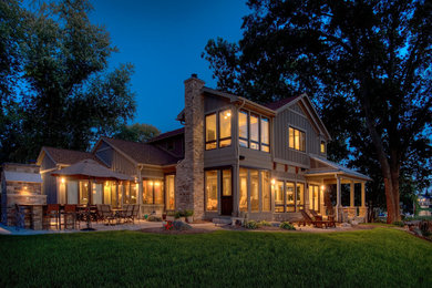 Large rustic beige two-story vinyl gable roof idea in Detroit