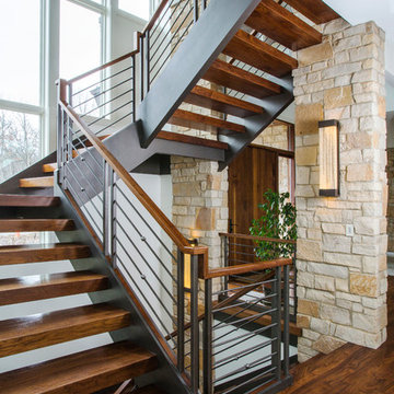 Floating Open Tread 3"x12" Walnut Staircase with Interior Stone Columns