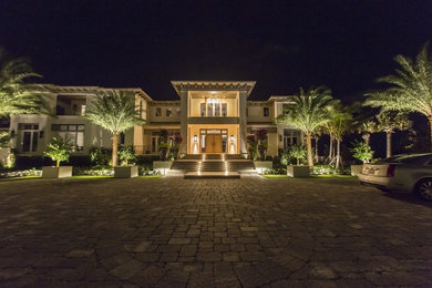 Huge modern beige two-story house exterior idea in Miami