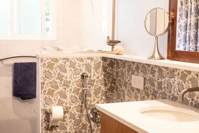 Inspiration for a mid-sized ceramic tile porcelain tile, black floor and single-sink bathroom remodel in Other with flat-panel cabinets, light wood cabinets, a wall-mount toilet, white walls, an undermount sink, quartzite countertops, white countertops and a floating vanity