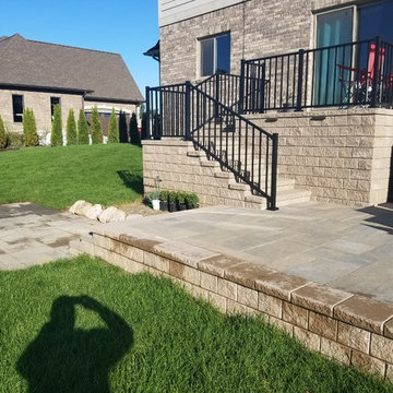 Three Tiered Unilock Patio on a waterfront.